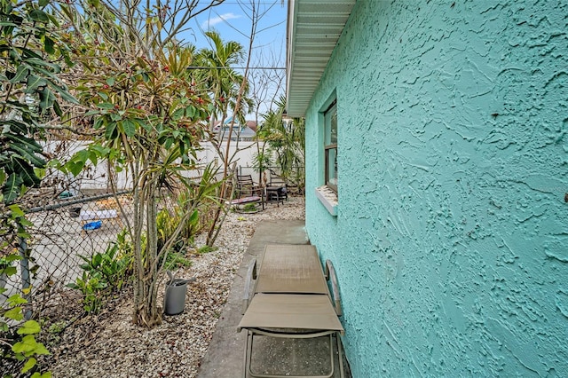 view of home's exterior with a fenced backyard and stucco siding