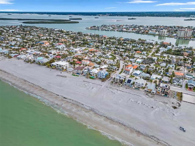 bird's eye view with a water view and a view of the beach