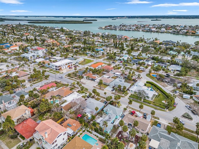 drone / aerial view featuring a residential view and a water view