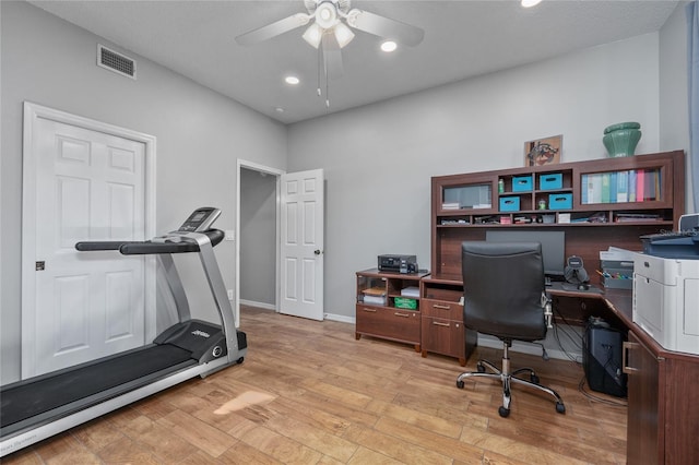 office featuring recessed lighting, visible vents, light wood-style flooring, a ceiling fan, and baseboards