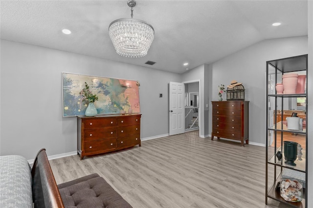 bedroom with recessed lighting, visible vents, an inviting chandelier, wood finished floors, and baseboards