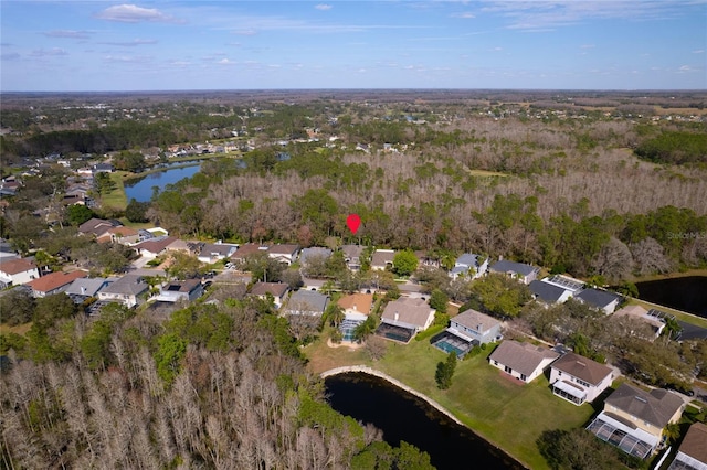 birds eye view of property featuring a water view and a residential view