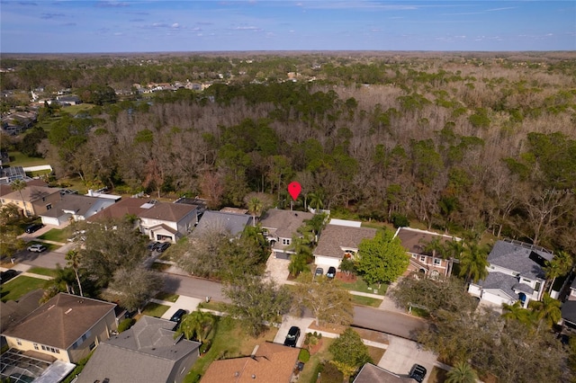 aerial view featuring a residential view and a view of trees