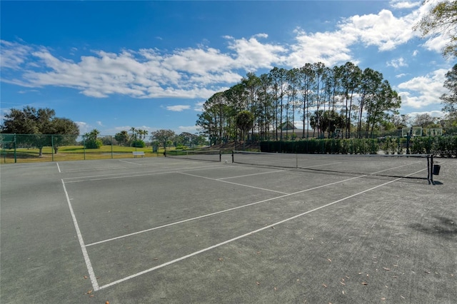 view of sport court with fence