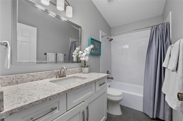 bathroom with toilet, tile patterned floors, shower / bath combo with shower curtain, a textured ceiling, and vanity