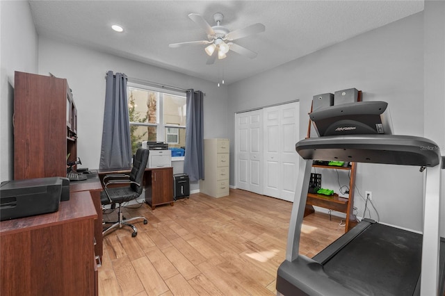 office area featuring ceiling fan, a textured ceiling, and light wood-style flooring