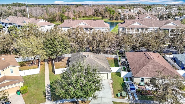 aerial view featuring a residential view and a water view