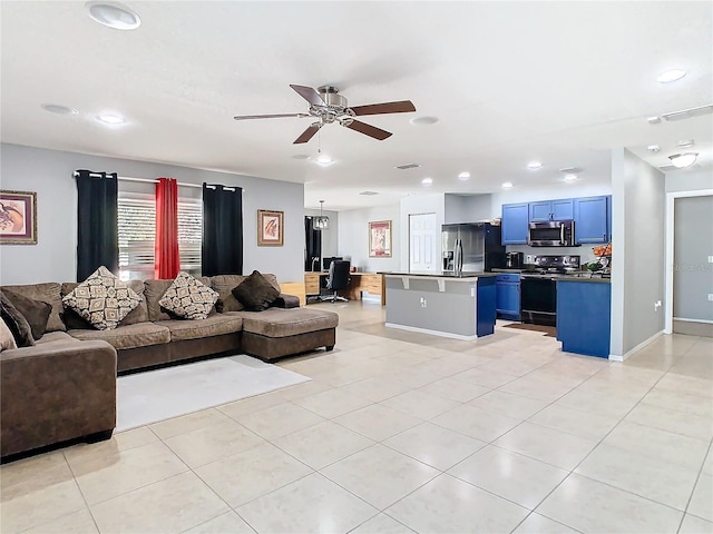 living area featuring light tile patterned floors, baseboards, a ceiling fan, and recessed lighting