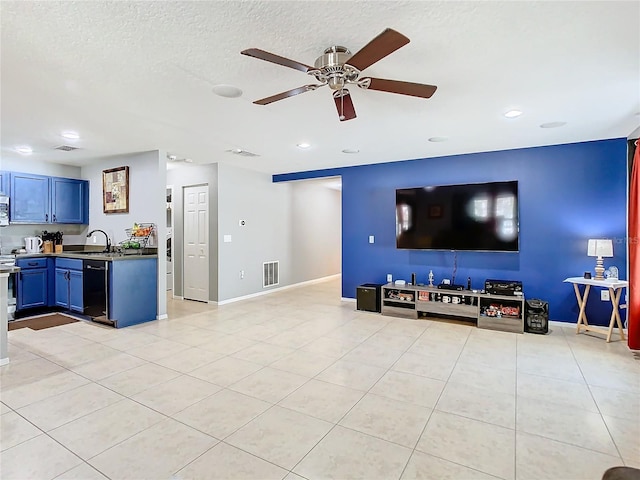 unfurnished living room featuring light tile patterned floors, visible vents, ceiling fan, a textured ceiling, and a sink