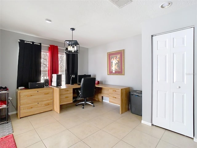 home office with light tile patterned floors, baseboards, visible vents, and a chandelier