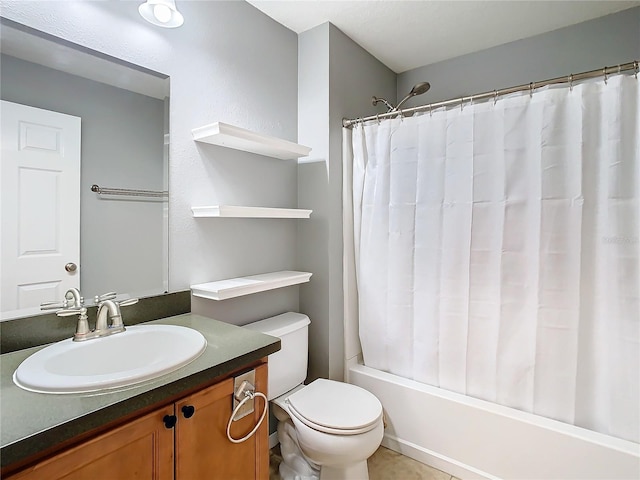 full bath with toilet, shower / bath combo with shower curtain, and vanity