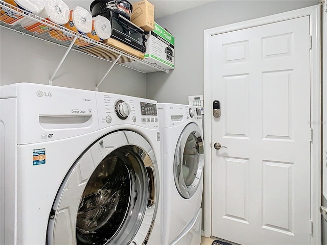 washroom with laundry area and separate washer and dryer