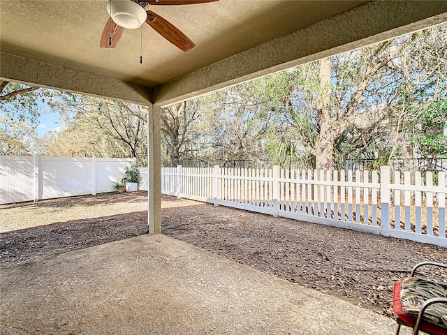 view of patio with a fenced backyard and ceiling fan