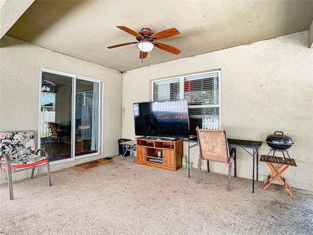 view of patio featuring ceiling fan