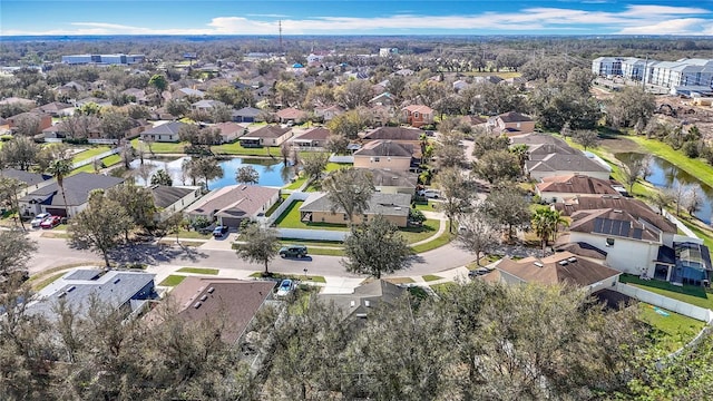 bird's eye view with a residential view and a water view