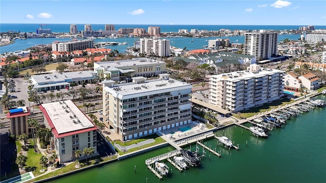 drone / aerial view featuring a water view and a city view