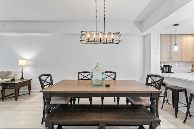 dining area featuring baseboards