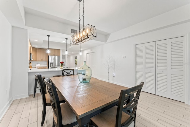 dining area featuring recessed lighting, light wood-type flooring, visible vents, and baseboards