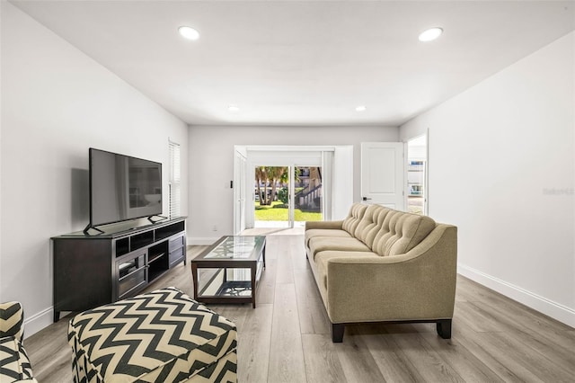 2101 Cordova Grn, Seminole, FL 33777 - living area featuring light wood-style floors, recessed lighting, and baseboards