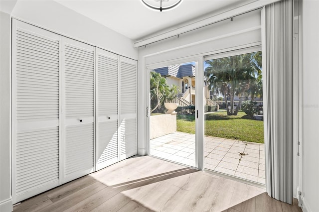 2101 Cordova Grn, Seminole, FL 33777 - doorway to outside featuring wood finished floors