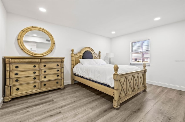 2101 Cordova Grn, Seminole, FL 33777 - bedroom featuring baseboards, wood finished floors, and recessed lighting