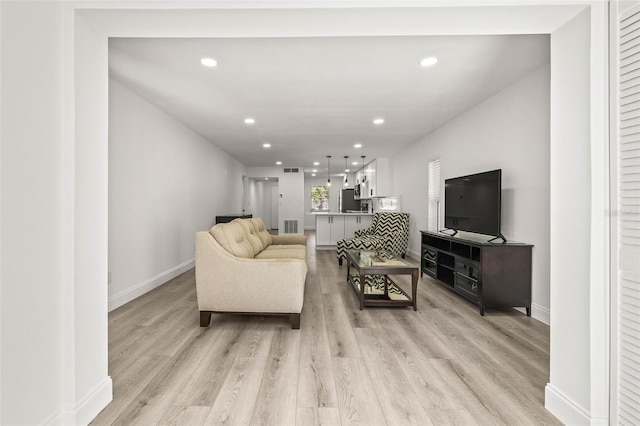 2101 Cordova Grn, Seminole, FL 33777 - living room with light wood-type flooring, baseboards, visible vents, and recessed lighting