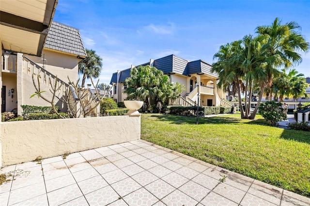 2101 Cordova Grn, Seminole, FL 33777 - view of property's community with a lawn