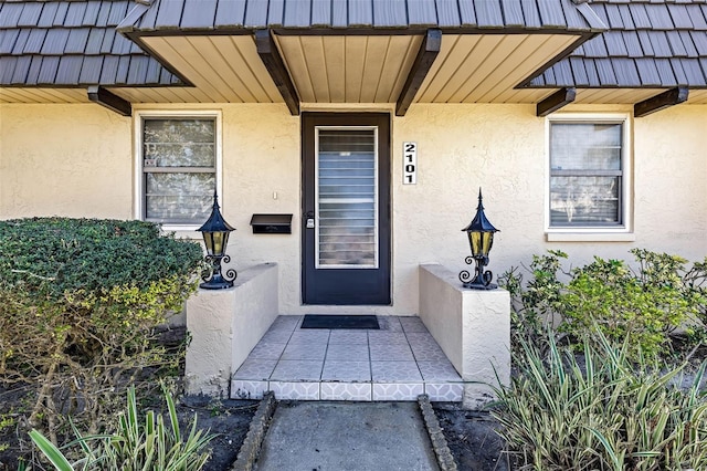 2101 Cordova Grn, Seminole, FL 33777 - property entrance with stucco siding