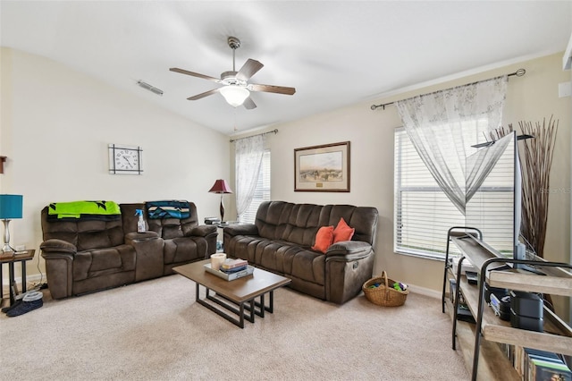 living area with light colored carpet, a ceiling fan, baseboards, vaulted ceiling, and visible vents