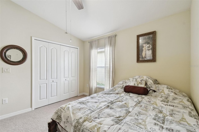 bedroom with baseboards, a ceiling fan, lofted ceiling, carpet, and a closet