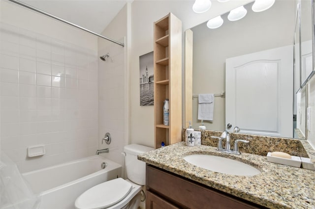 bathroom featuring toilet, shower / bathing tub combination, and vanity