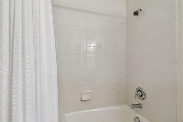 bathroom featuring shower / bath combination with curtain