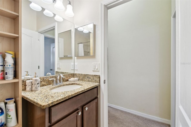 bathroom featuring vanity and baseboards