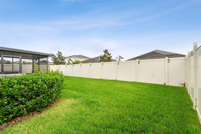 view of yard with a fenced backyard