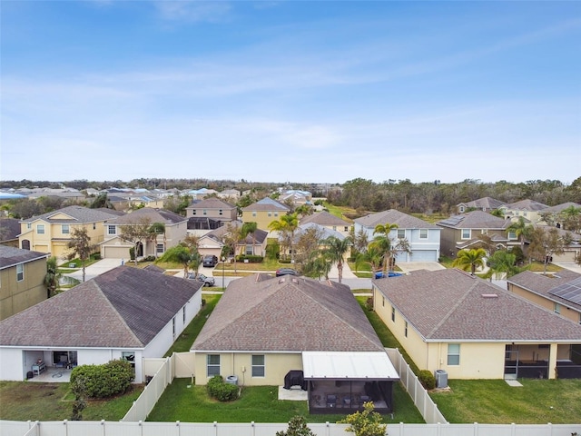 birds eye view of property with a residential view