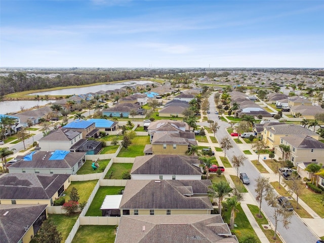 aerial view featuring a water view and a residential view