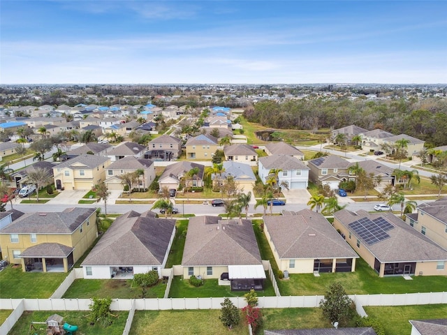 birds eye view of property with a residential view