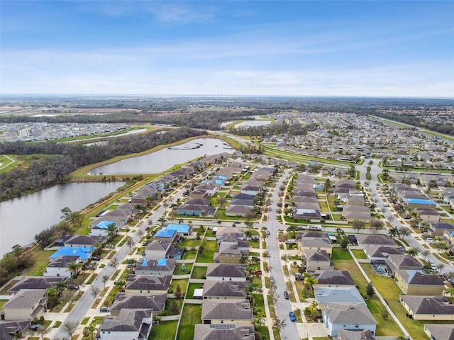 aerial view with a water view and a residential view