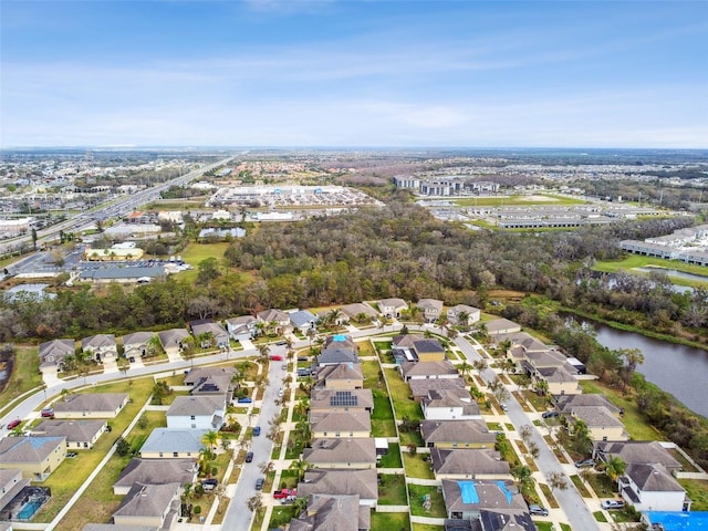 bird's eye view with a water view and a residential view