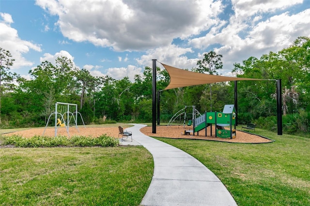 community jungle gym with a lawn