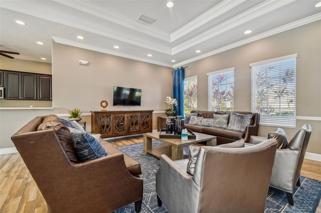 living area with crown molding, recessed lighting, visible vents, ceiling fan, and wood finished floors