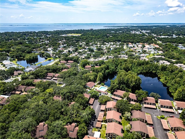 birds eye view of property with a water view and a residential view