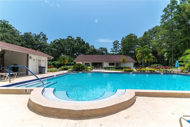 pool with a patio area