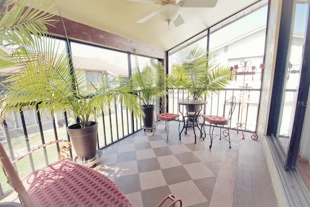 sunroom featuring ceiling fan