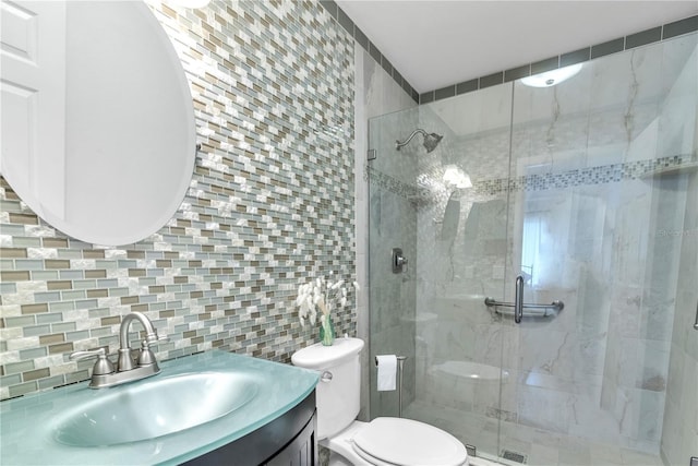 bathroom featuring a stall shower, toilet, backsplash, vanity, and tile walls