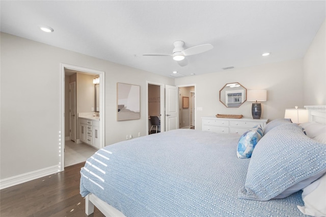 bedroom with recessed lighting, wood finished floors, visible vents, baseboards, and a spacious closet