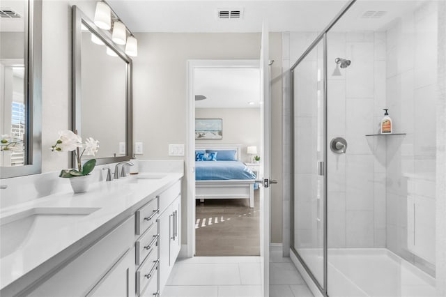 bathroom featuring ensuite bathroom, a sink, visible vents, tile patterned floors, and a stall shower