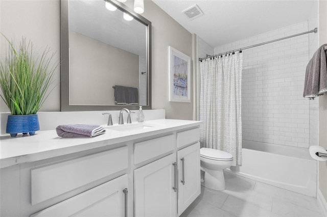 bathroom with toilet, shower / tub combo, visible vents, and vanity