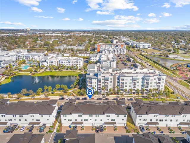 drone / aerial view featuring a residential view and a water view