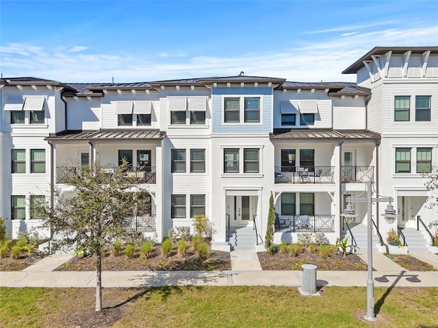 multi unit property featuring a standing seam roof and metal roof